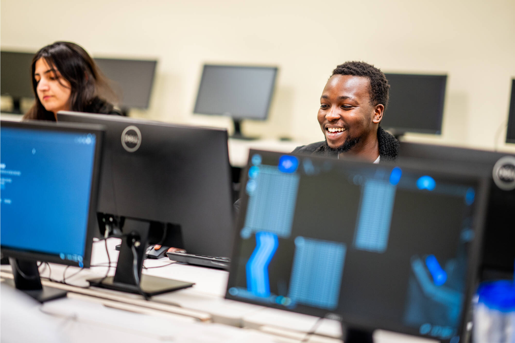 Students from Professor Samah Mansour's computing class work in the Cyber Threat Range, December 4, 2023.